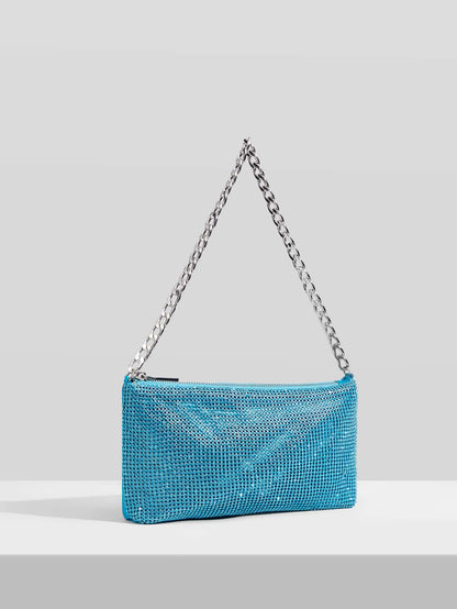 Bolso de hombre con cadena y detalle de diamantes preciosos